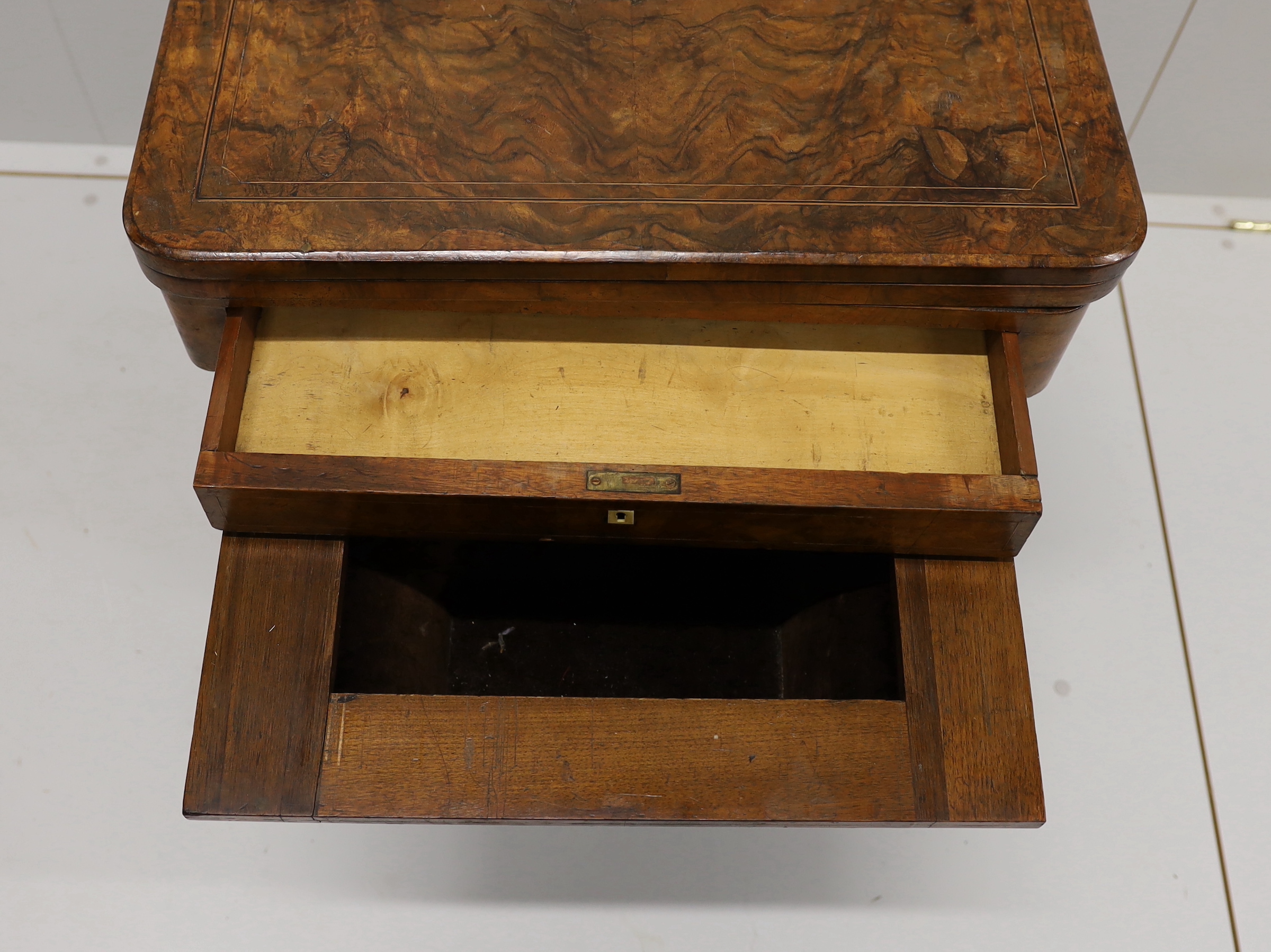A Victorian figured walnut rectangular sewing / games table, width 58cm, depth 41cm, height 69cm